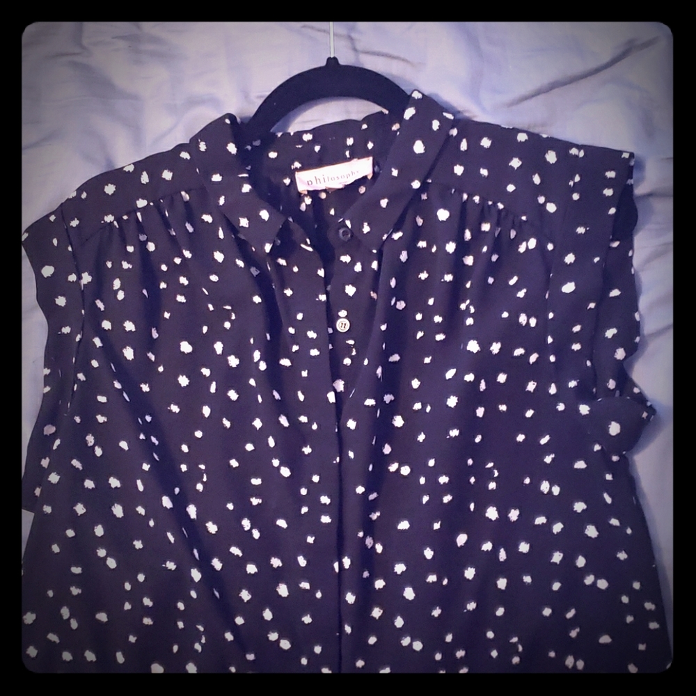 Black and white spotted sleeveless button up shirt